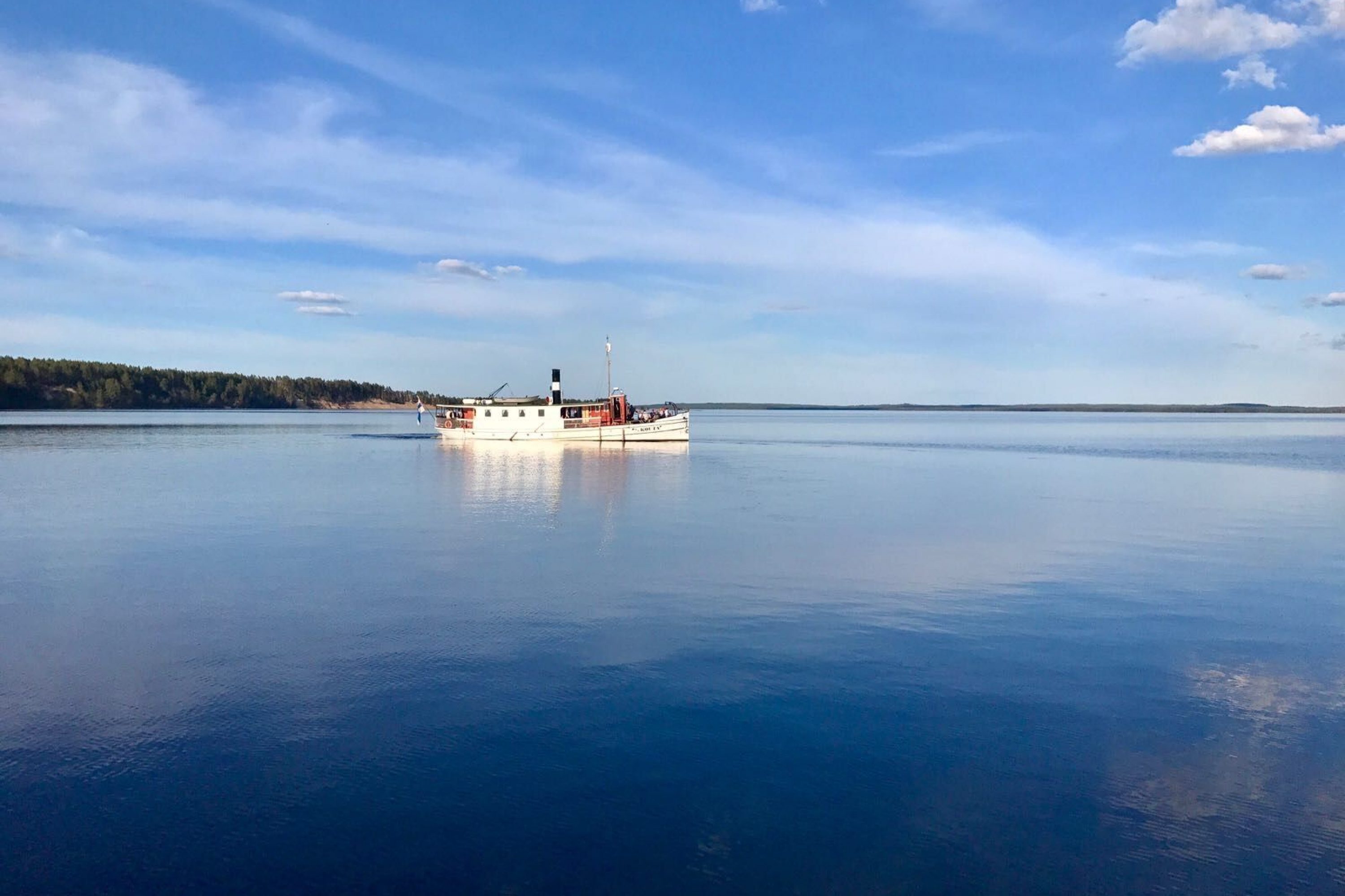 Steamship cruising on a lake