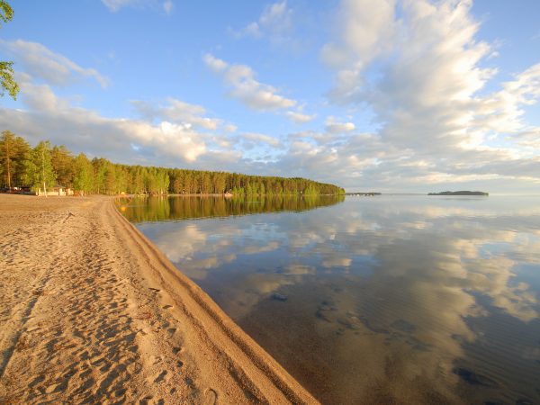 A sand beach by the lake