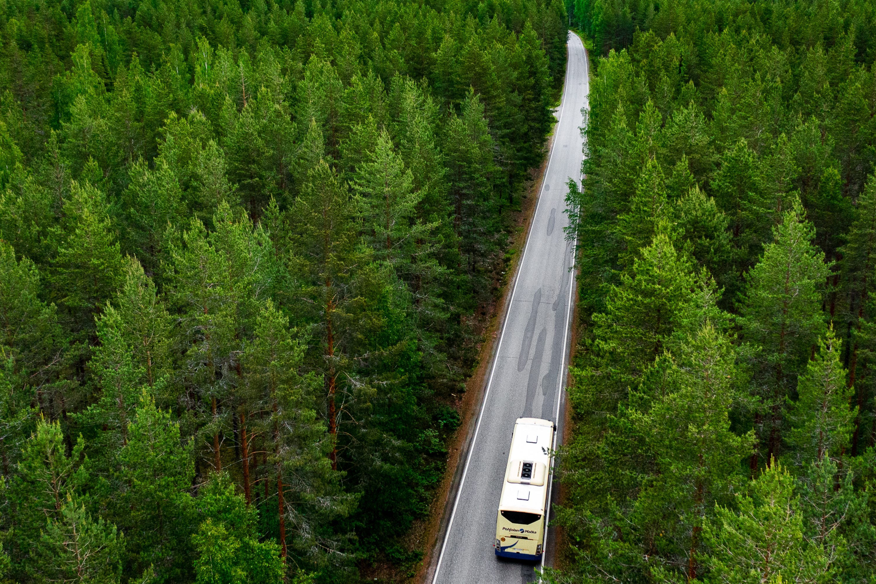 A bus driving along the road
