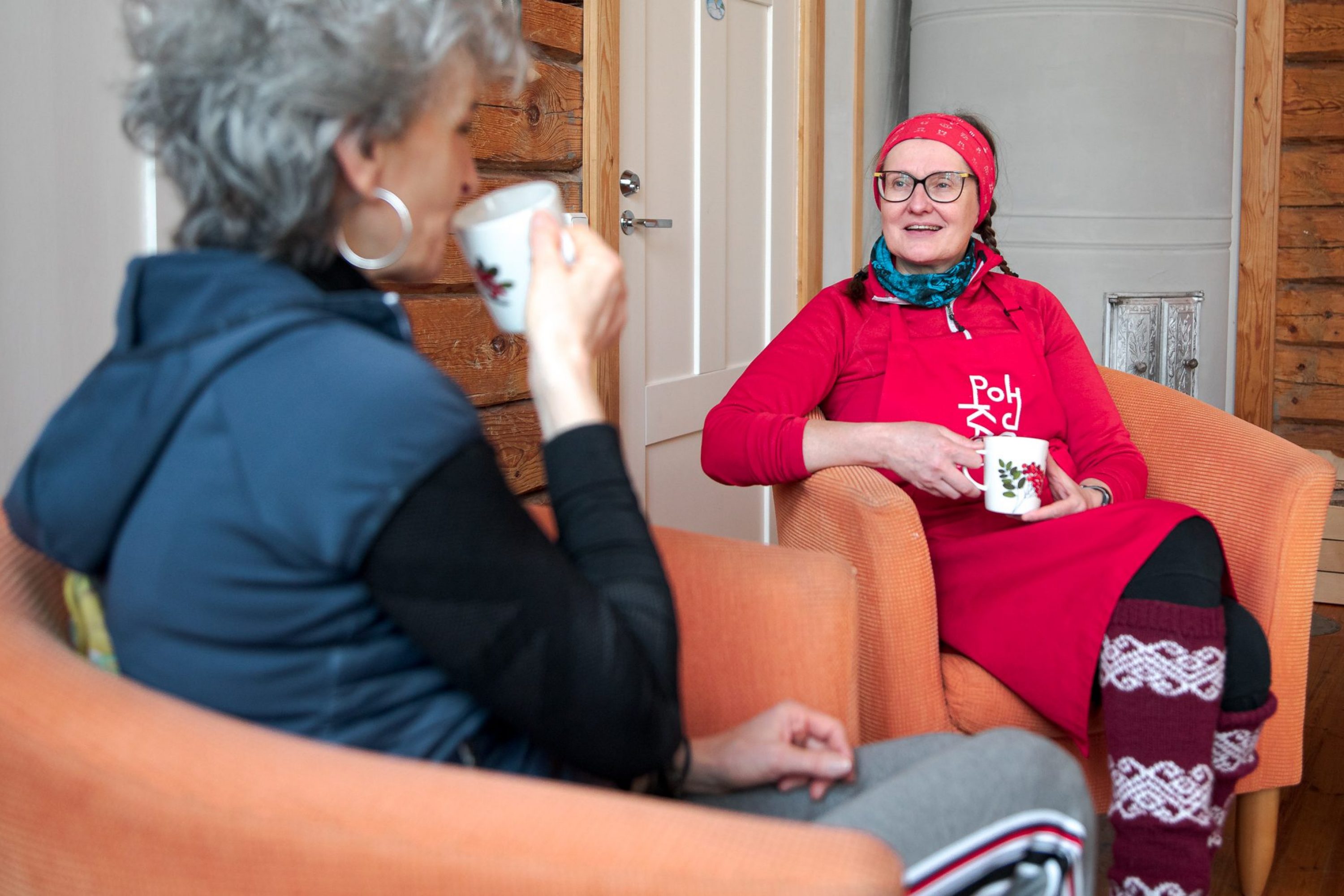 Two women drinking coffee together