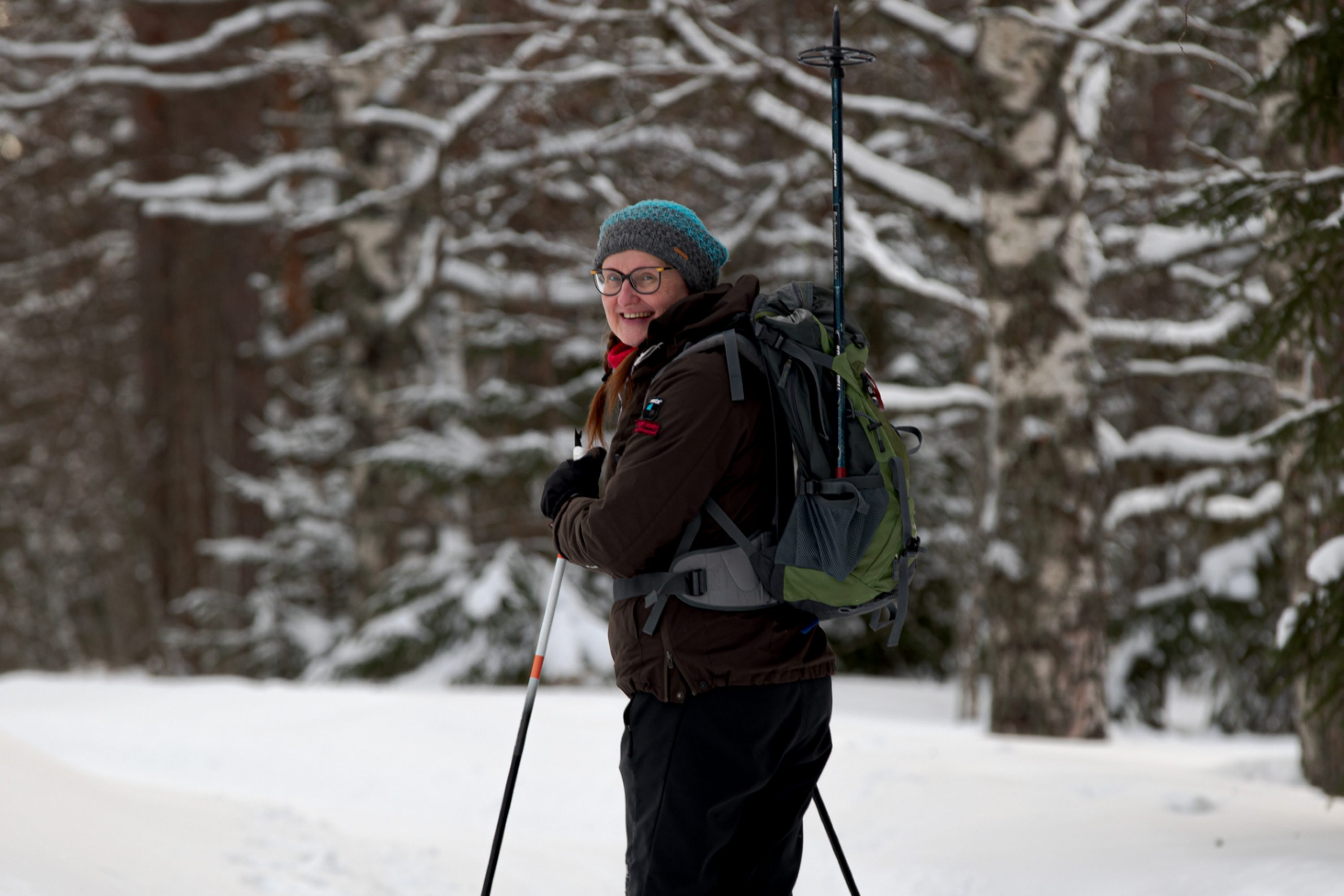 A woman skiing in the forest