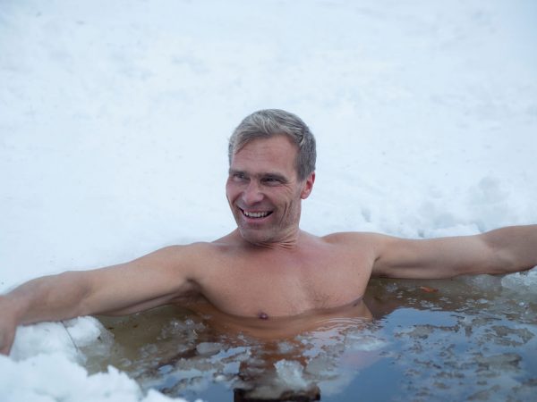A man ice swimming on the lake