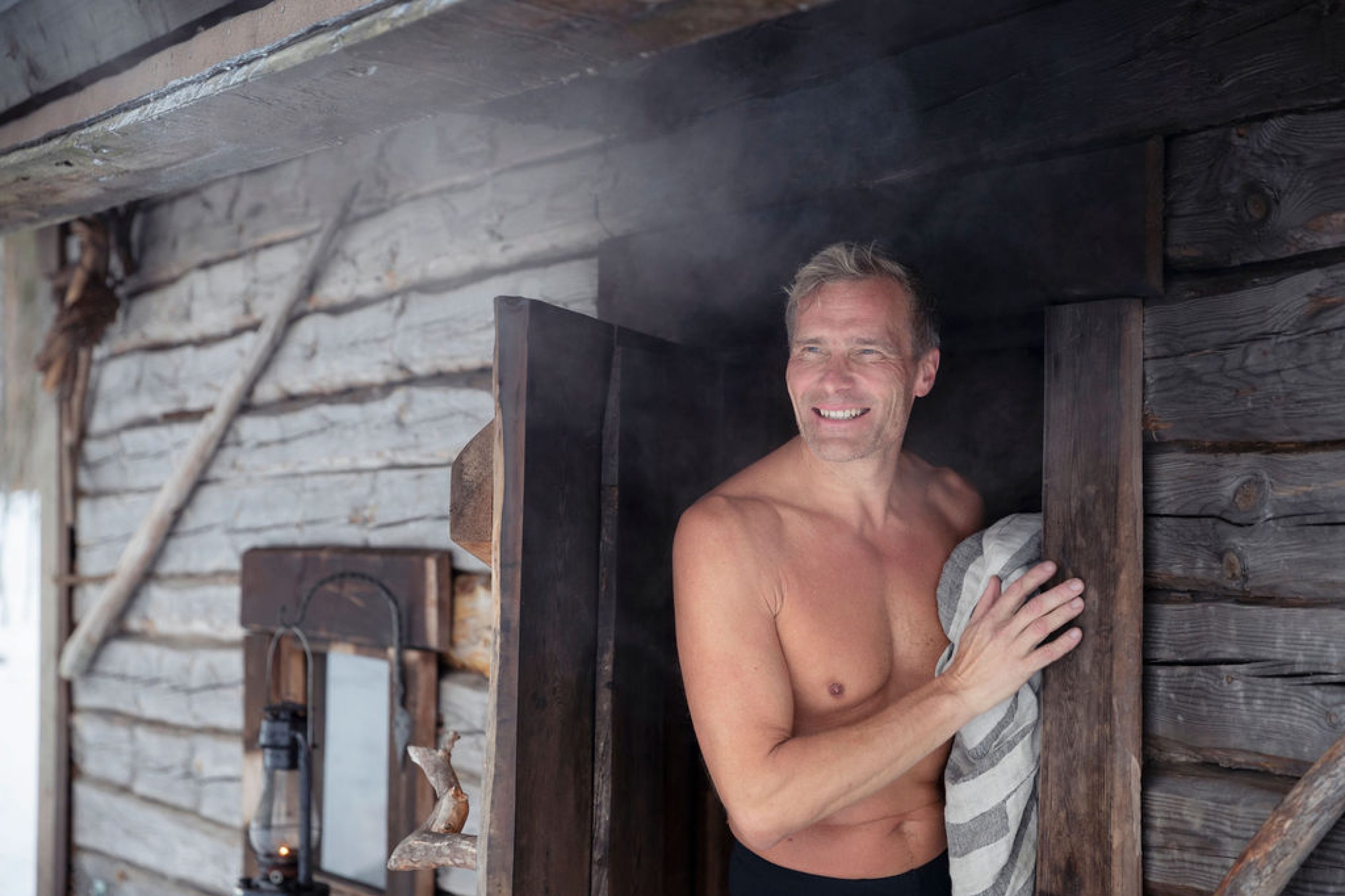 A man standing in front of the sauna