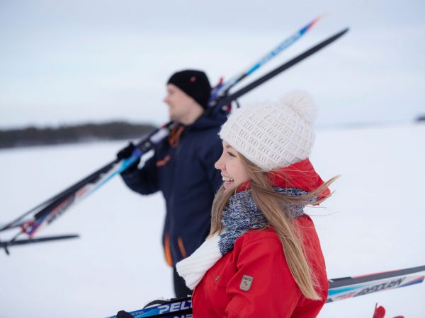 Happy skiiers on frozen lake
