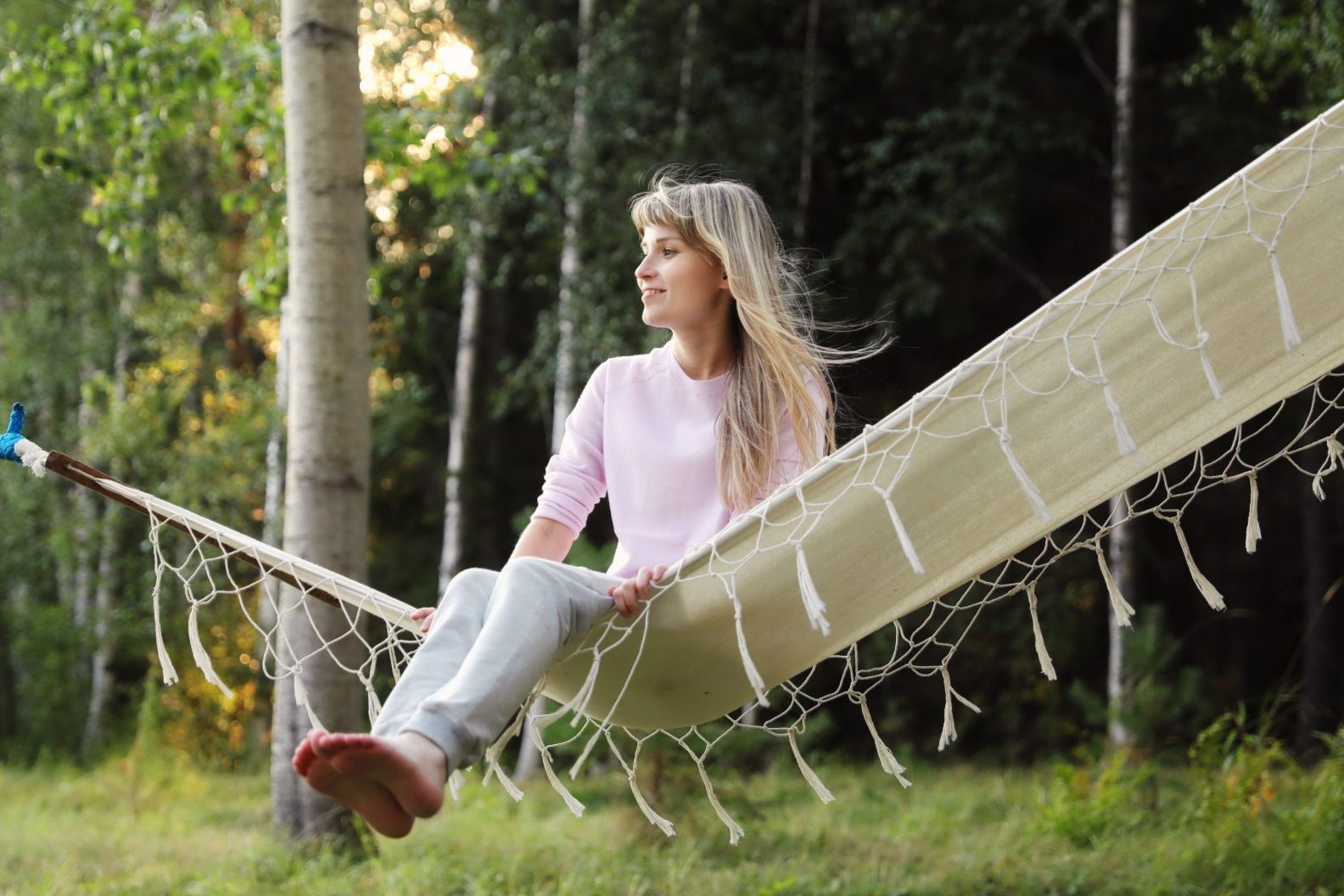 A woman sits in a hammock