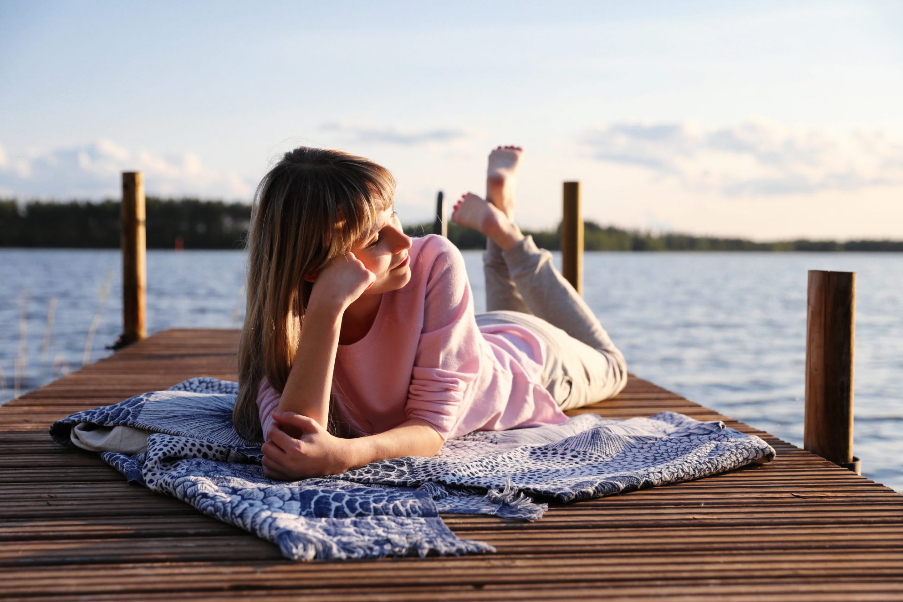 vk-girl-laying-on-a-wharf