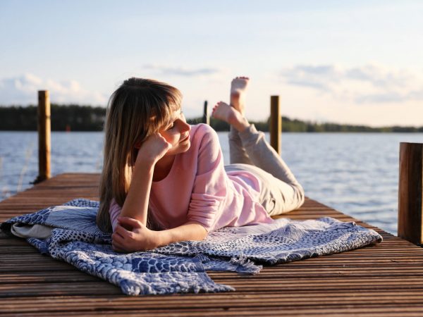 vk-girl-laying-on-a-wharf